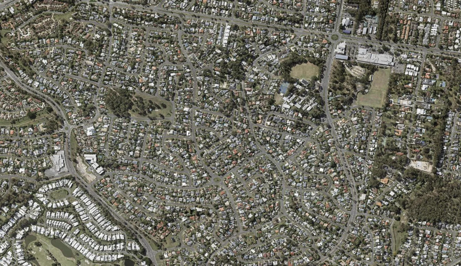 Aerial view of homes and properties in Ashmore, Queensland