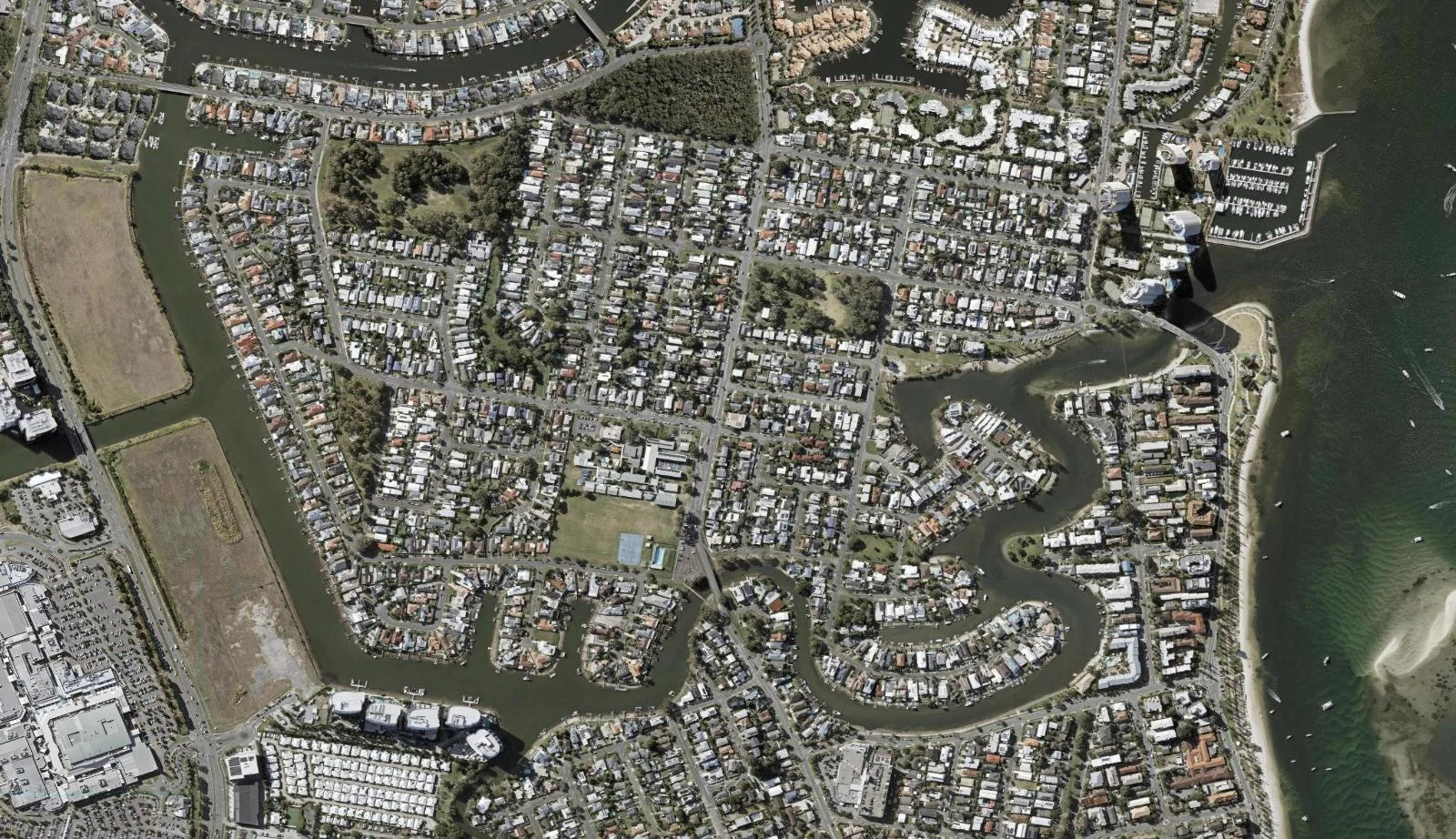 Aerial view of homes and properties in Biggera Waters, Queensland