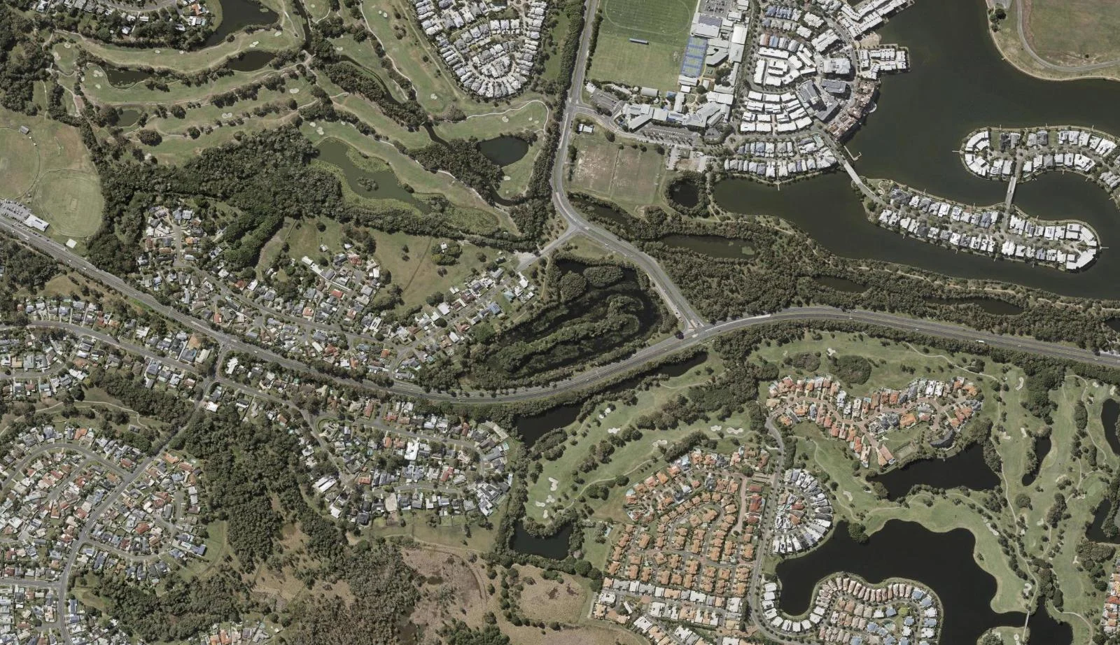 Aerial view of homes and properties in Carrara, Queensland