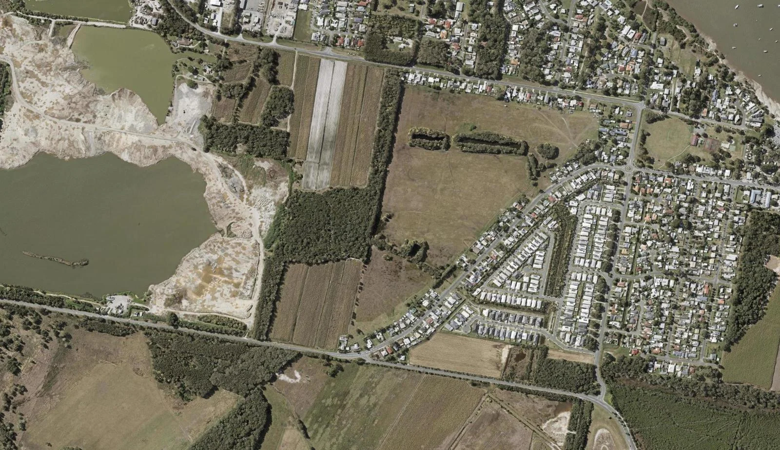 Aerial view of homes and properties in Jacobs Well, Queensland