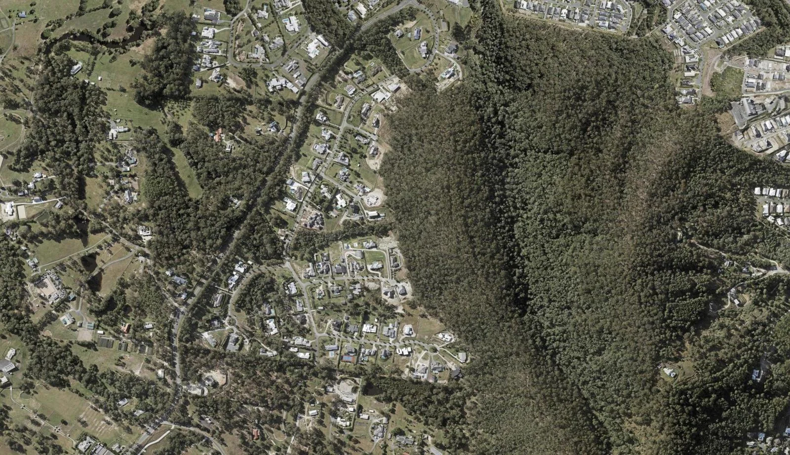 Aerial view of homes and properties in Maudsland, Queensland