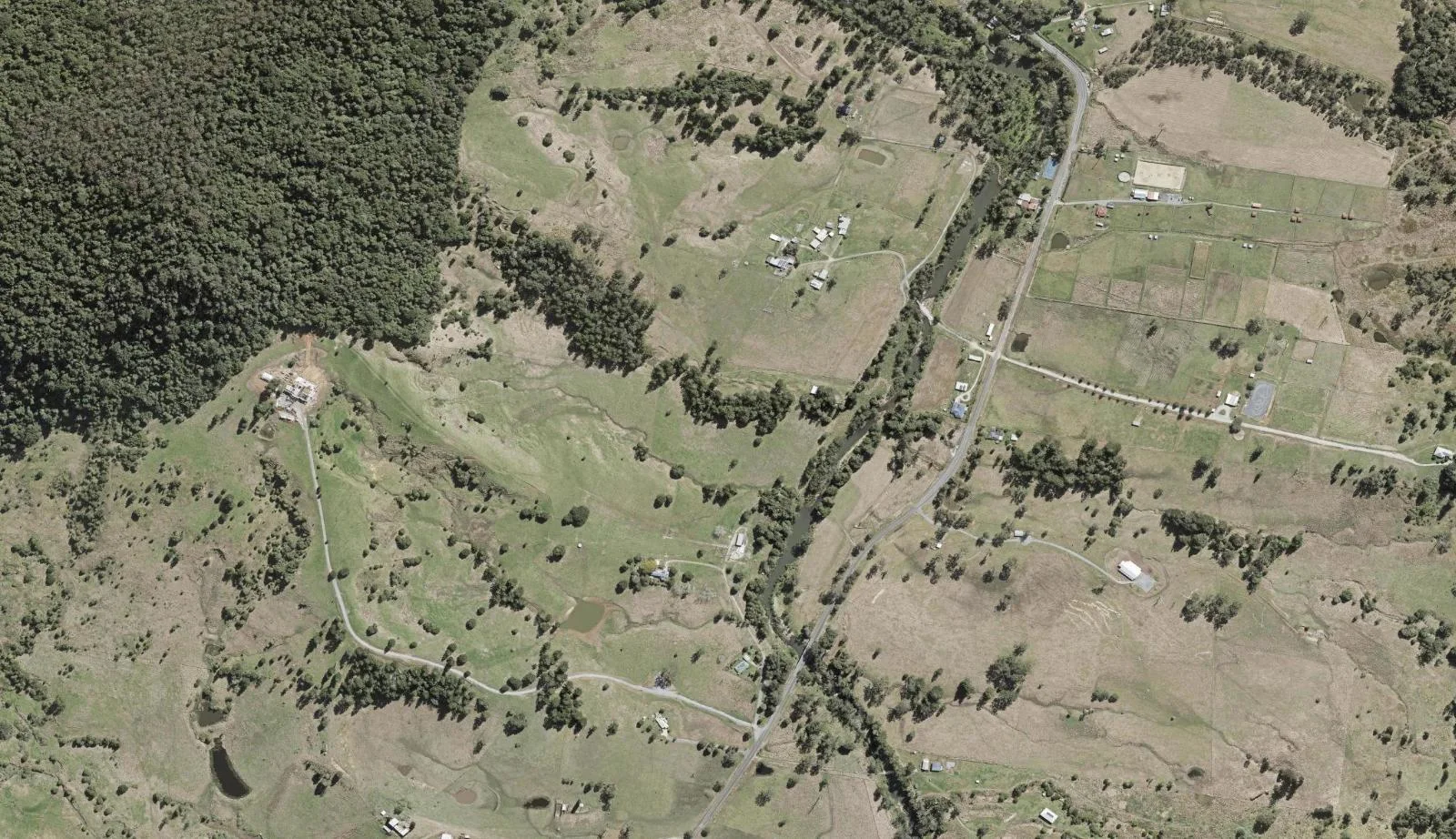 Aerial view of homes and properties in Numinbah Valley, Queensland