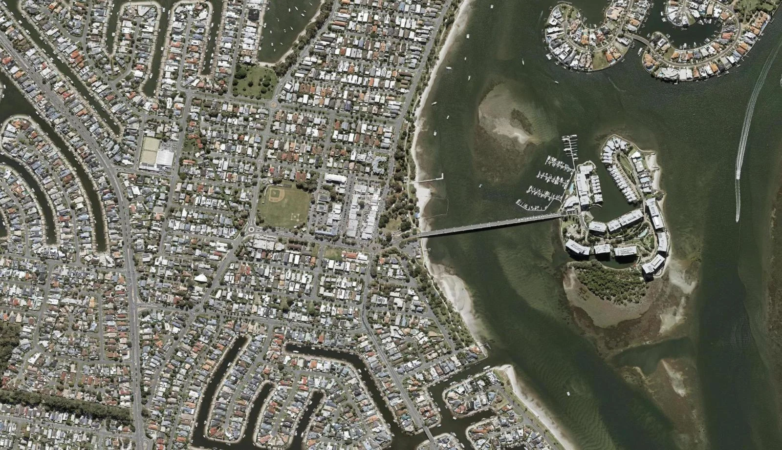 Aerial view of homes and properties in Paradise Point, Queensland