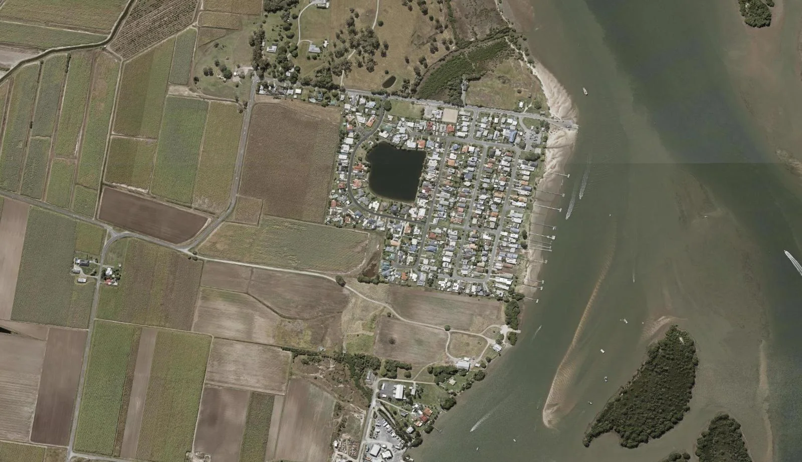 Aerial view of homes and properties in Steiglitz, Queensland